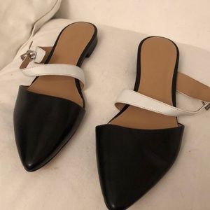 Black and white leather flats